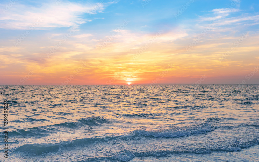 calmness seascape in colorful sunset sky
