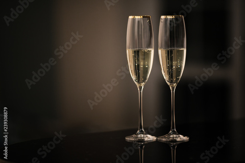 A pair of glasses of champagne in the interior. New Year and others holiday concept.