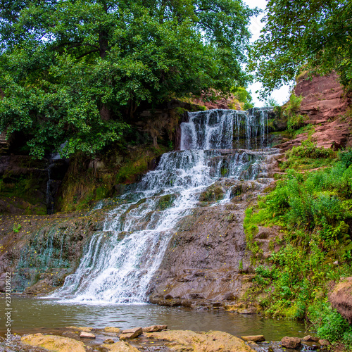 Photo of high waterfall in the mountains