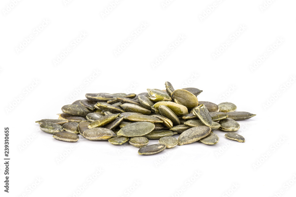 Hulled pumpkin seeds isolated on white Hulled pumpkin seeds isolated on white