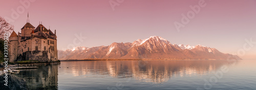 Leinwand Poster Panoramic view over bloody sunset at Swiss Alpes mountains, Leman lake and old c