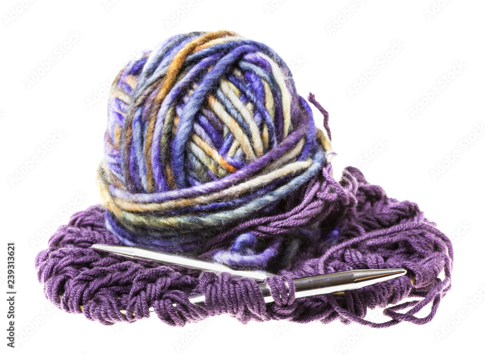 ball of yarn and needles in knitted fabric ball of yarn and needles in knitted fabric