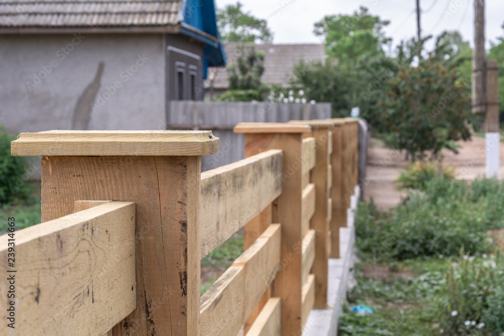 Building a fence in the style of a ranch. Wooden fence details. Building a fence in the style of a ranch. Wooden fence details.