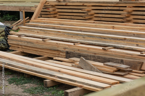 Wooden boards and planks on the construction of a frame house