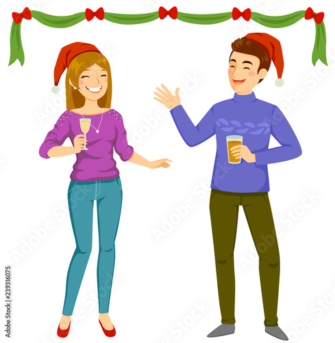 Happy man and woman wearing Santa hats and holding drinks at a Christmas party