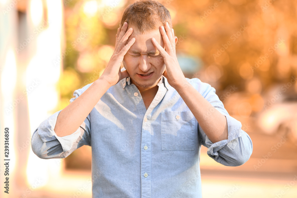 Fototapeta premium Man having panic attack outdoors