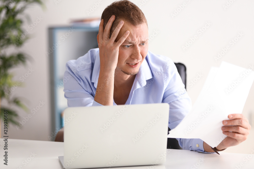 Man having panic attack at workplace in office Man having panic attack at workplace in office