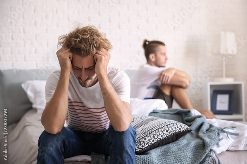 Young gay couple in quarrel...