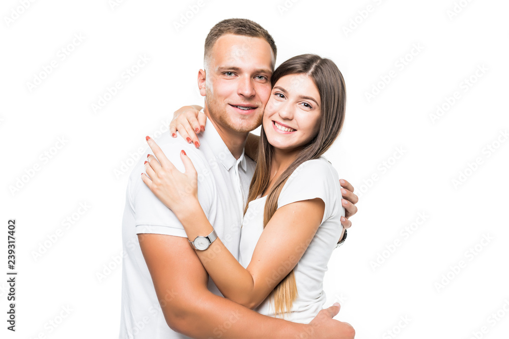 Cheerful young couple standing on white background Cheerful young couple standing on white background