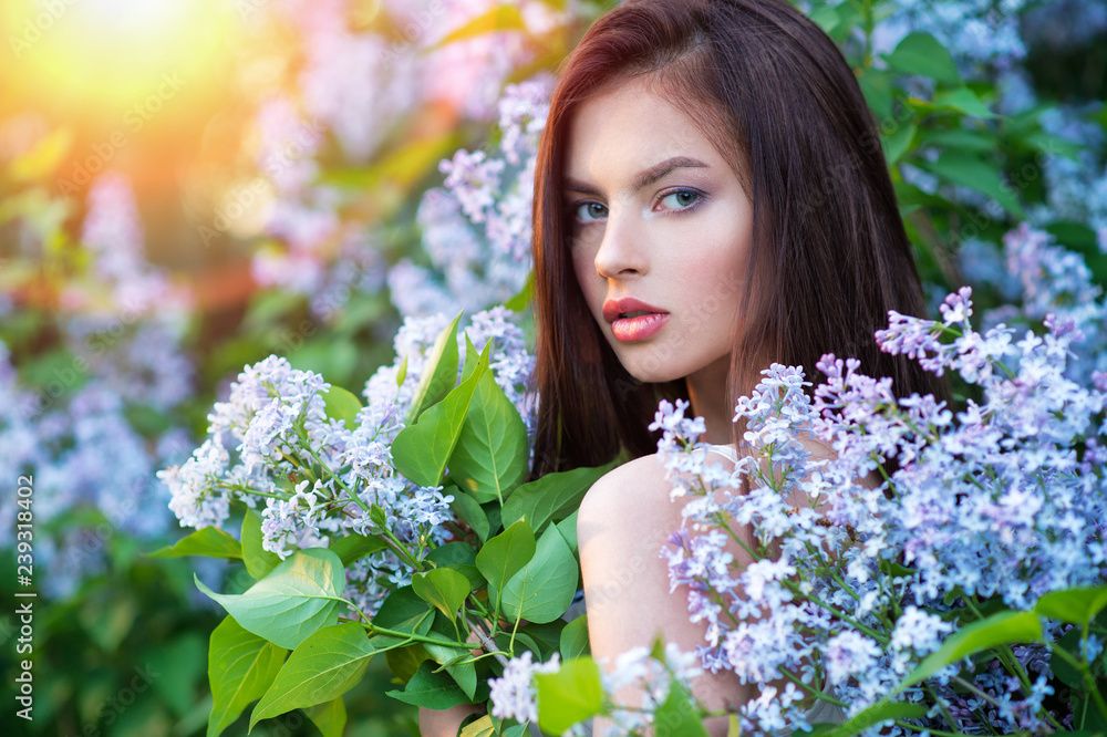 Pretty young woman posing outdoors in nature. Pretty young woman posing outdoors in nature.