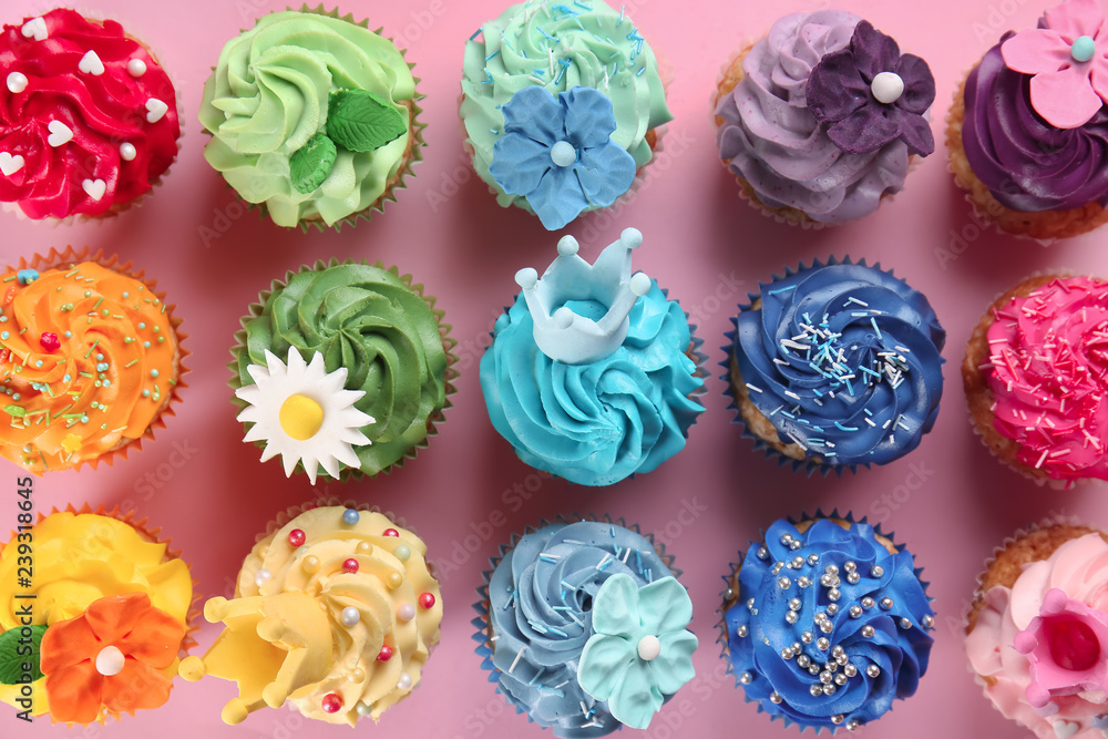 Delicious cupcakes on color background Delicious cupcakes on color background