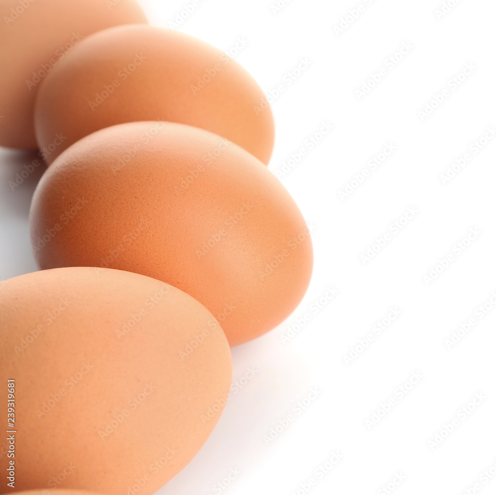 Raw brown chicken eggs on white background Raw brown chicken eggs on white background