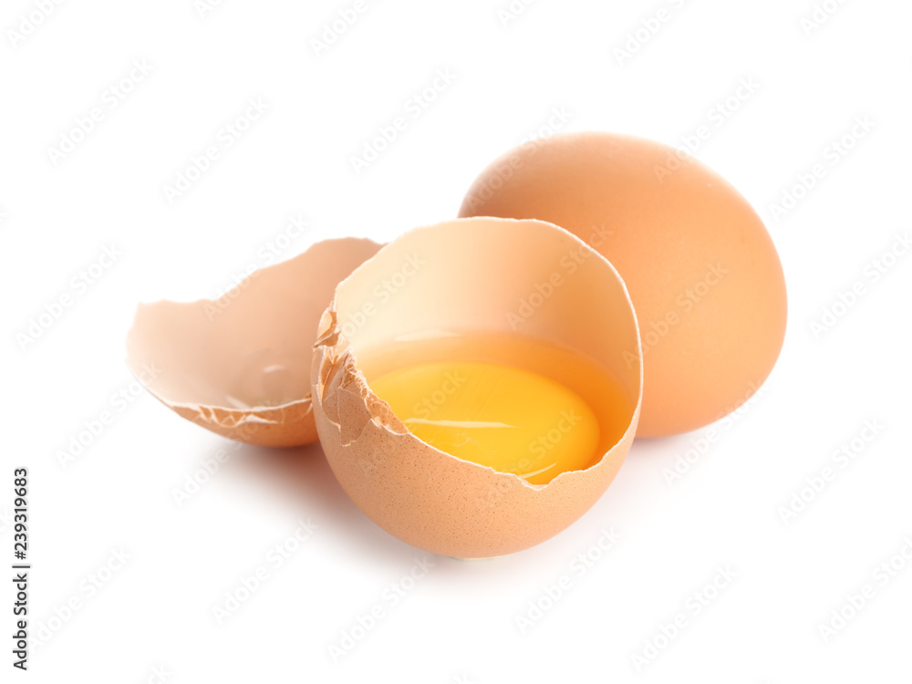 Cracked and whole chicken eggs on white background Cracked and whole chicken eggs on white background