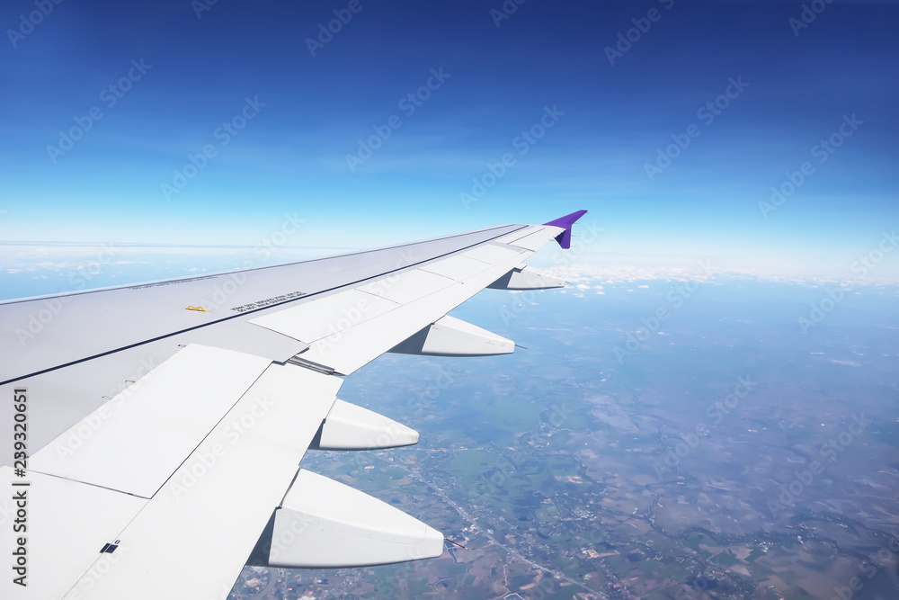 Dramatic atmosphere panorama view of beautiful blue sky and soft white clouds from aircraft.