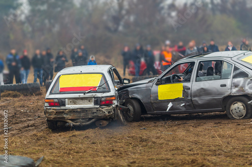 Fototapeta Naklejka Na Ścianę i Meble -  a race of cars that hit each other. old broken cars in crashes during a race. auto catch and car crash rally