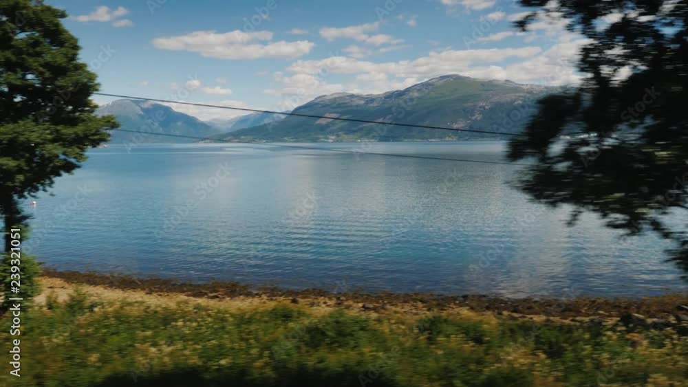 Ride along the picturesque coast of the Norwegian fjord, in search of the perfect place for camping Ride along the picturesque coast of the Norwegian fjord, in search of the perfect place for camping