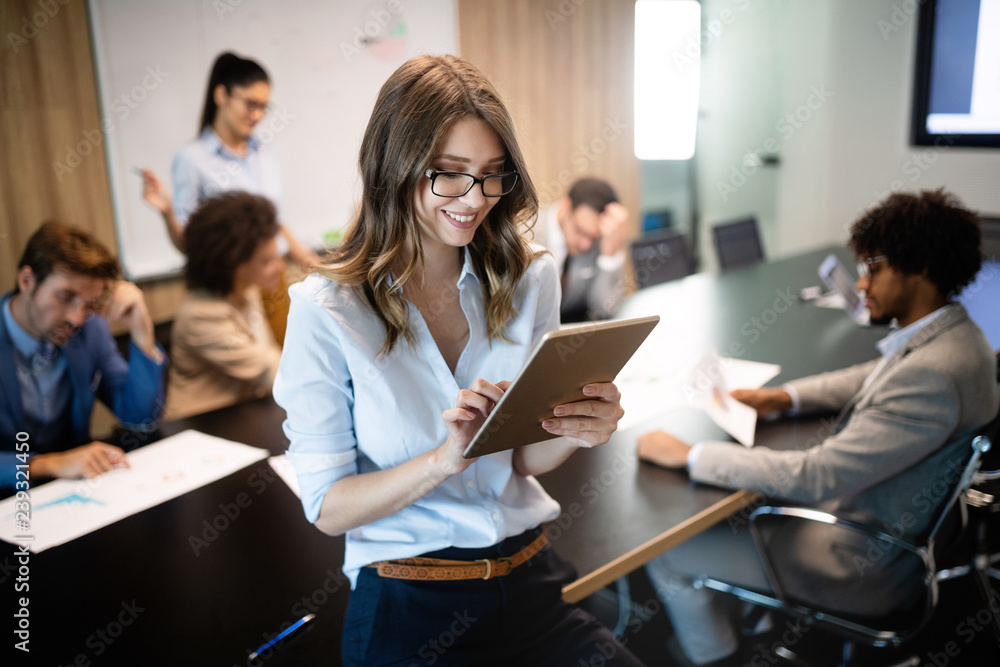 Group of successful business people at work in office Group of successful business people at work in office