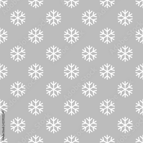 Simple snowflake pattern on grey background.