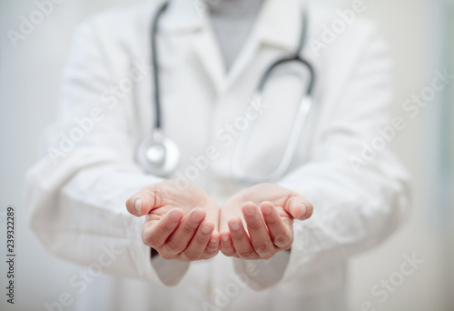 Empty hands of the Doctor , medical professional handed holding virtual object to paste text or item product . healthcare and advertisement concept, copy space photo