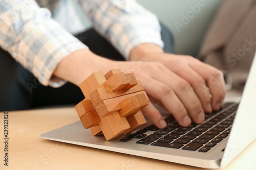 Photos Brain teaser on laptop of working man