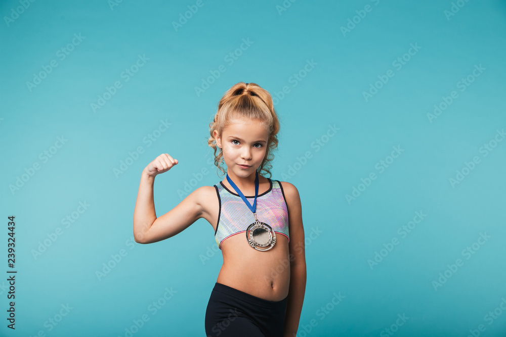Cheerful little sports girl celebrating the win Cheerful little sports girl celebrating the win