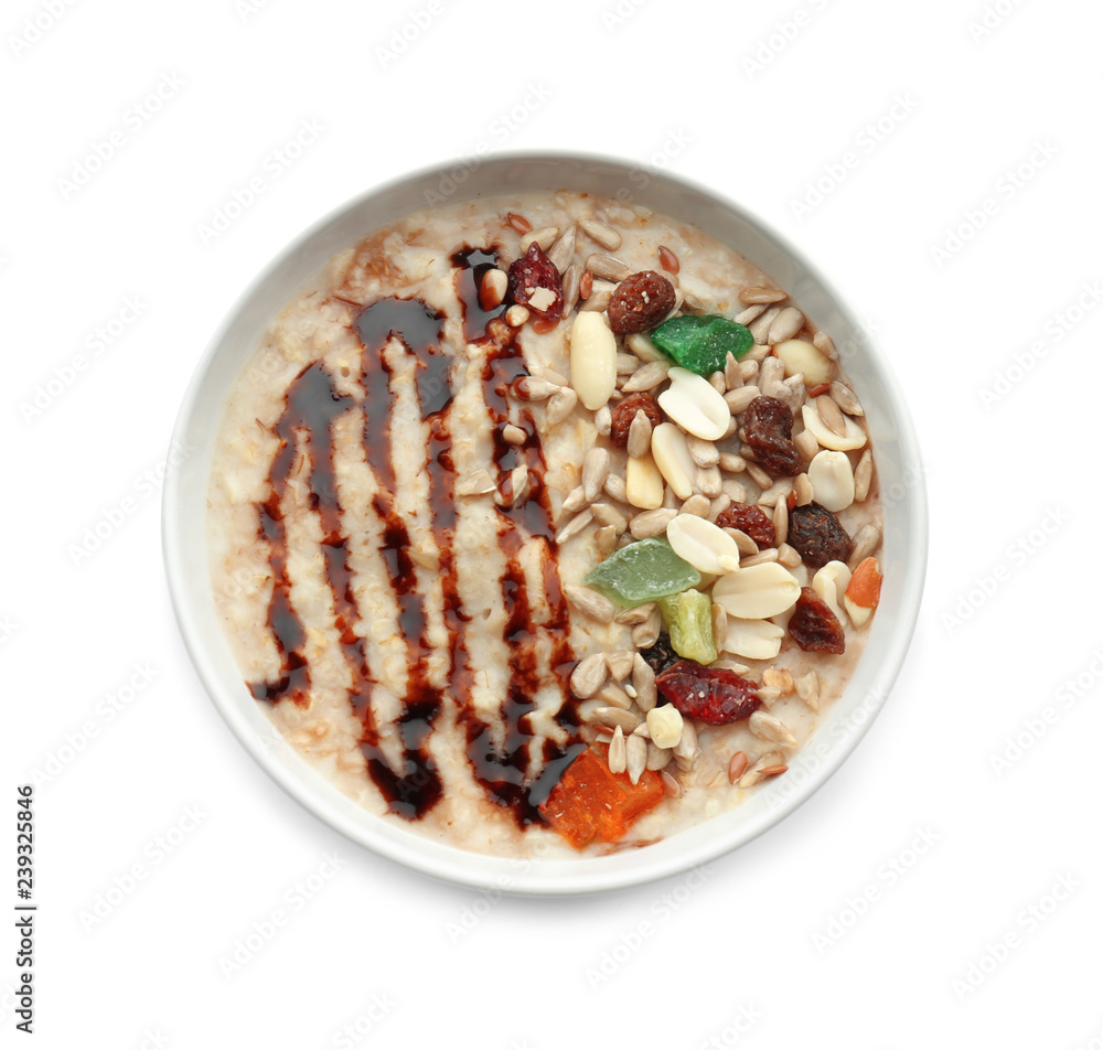 Tasty oatmeal with nuts and chocolate sauce in bowl on white background Tasty oatmeal with nuts and chocolate sauce in bowl on white background