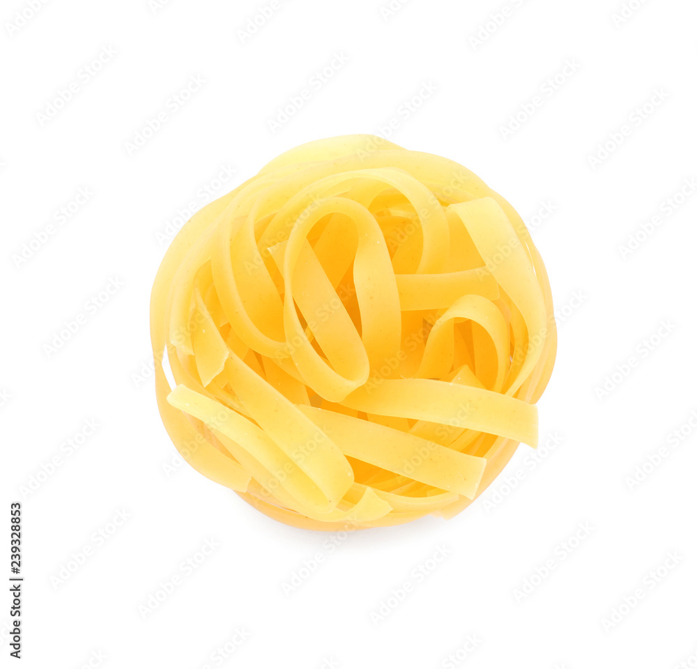 Uncooked fettuccine pasta on white background Uncooked fettuccine pasta on white background