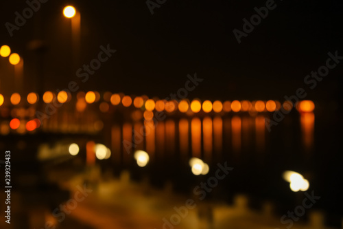 Blurred view of illuminated city at night © Pixel-Shot