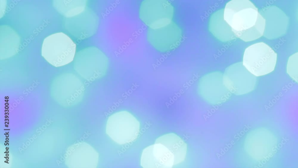 Abstract smooth turquoise and green bokeh lights on blurred purple background. Bright bokeh effect on defocused sparkling background. Holiday spirit. Abstract smooth turquoise and green bokeh lights on blurred purple background. Bright bokeh effect on defocused sparkling background. Holiday spirit.