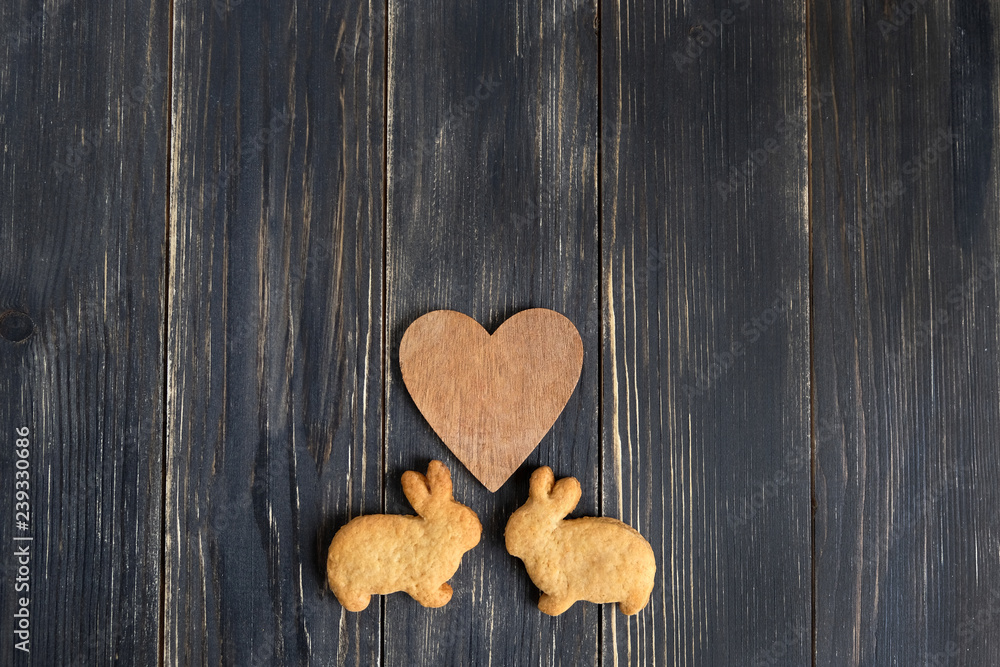 Easter still life. cookies bunnies and heart. Dark tone, soft focus, background mode Easter still life. cookies bunnies and heart. Dark tone, soft focus, background mode