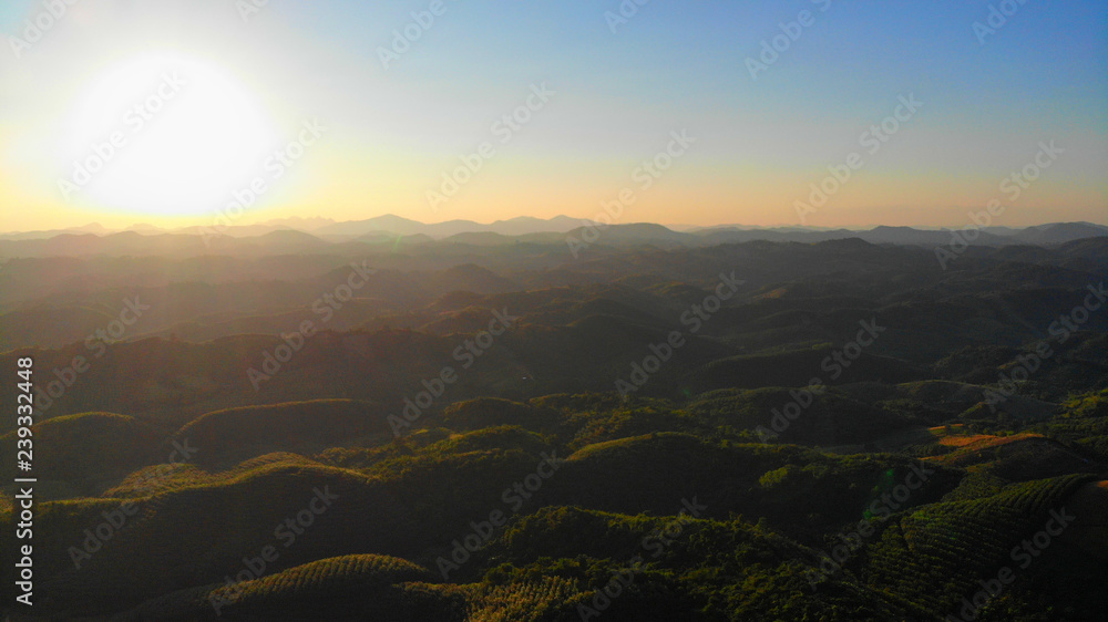 Aerial views of the sunrise on the valley on a natural background.
