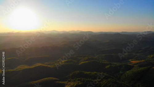 Aerial views of the sunrise on the valley on a natural background.
