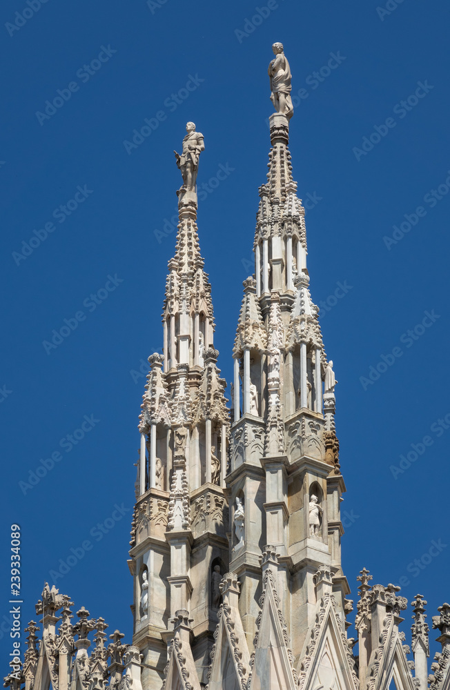 Marble statues on top of cathedral roof Marble statues on top of cathedral roof