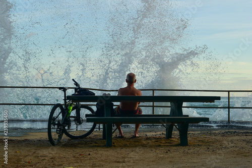 man sitting on a bench in park