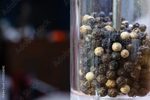 Fotografie Black pepper in the grinder