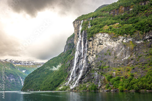 Amazing waterfall at the fjords of Norway in a overcast sky