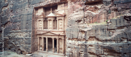 ancient treasury in Petra Jordan seen from the Siq. view from the top. main attraction of the lost city of Petra in Jordan. The temple is entirely carved into the rock. Ancient architecture.