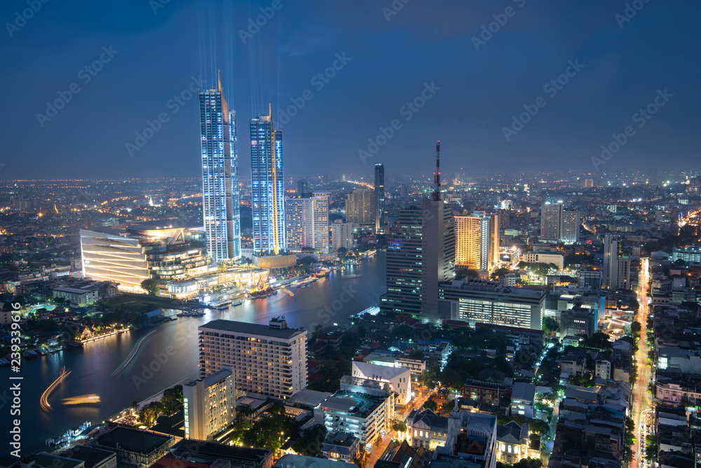Scenic view of the Chao Phraya River in Bangkok city downtown during twilight, capital of Thailand.