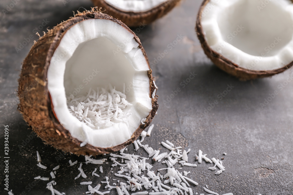 Half of ripe coconut on grey background Half of ripe coconut on grey background