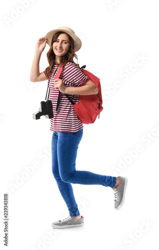 Young female tourist on white background