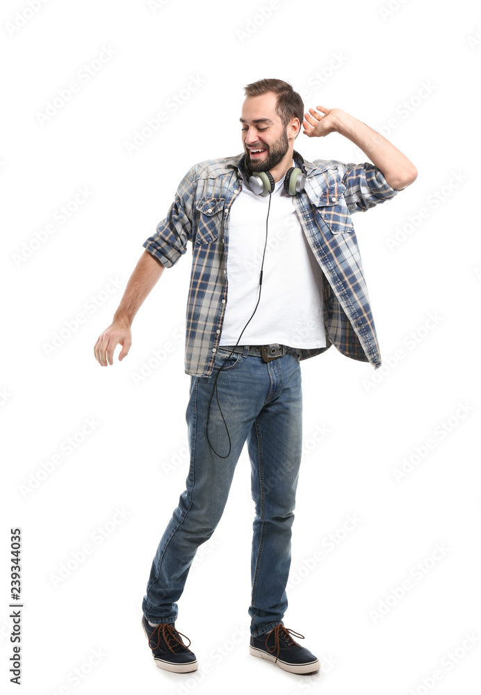 Fototapeta premium Handsome young man dancing on white background