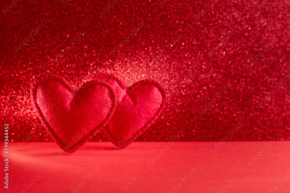 Felt hearts on red background with bokeh. Valentine's day celebration or love concept. Copy space. Toned Felt hearts on red background with bokeh. Valentine's day celebration or love concept. Copy space. Toned