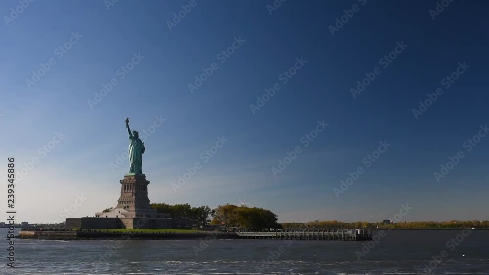 Statue of Liberty seen from the ferry in the Hudson river. Symbol of the New york. Statue of Liberty seen from the ferry in the Hudson river. Symbol of the New york.