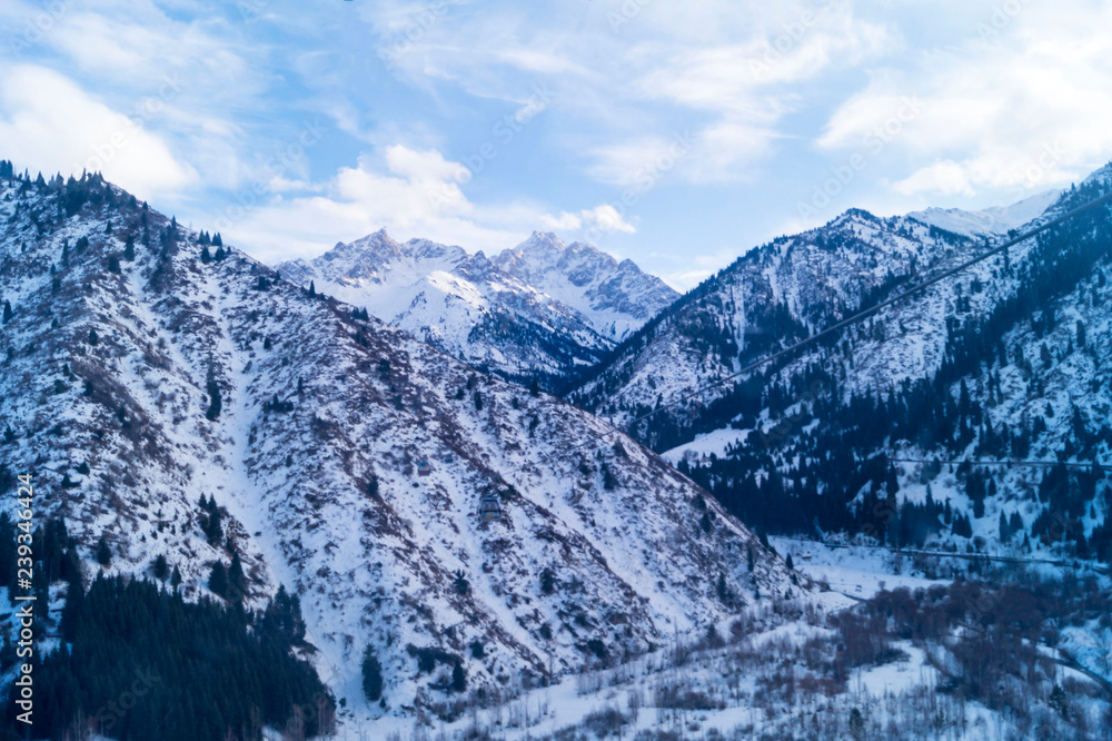 Obraz premium Winter landscape. Highlands. Almaty, Kazakhstan. Gondola road to the mountain resort.