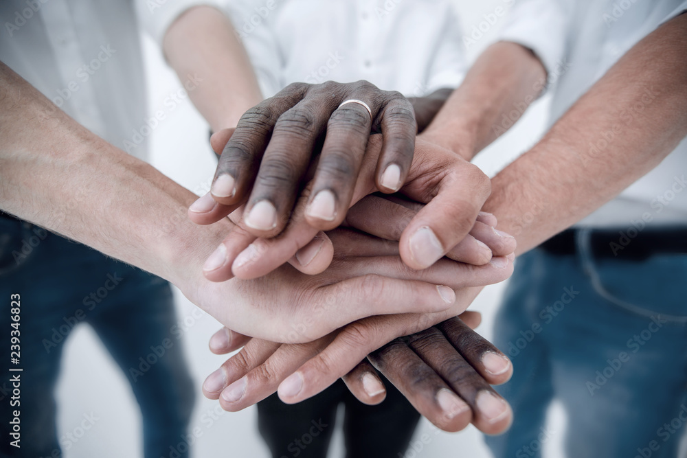 Business team joining hands together Business team joining hands together