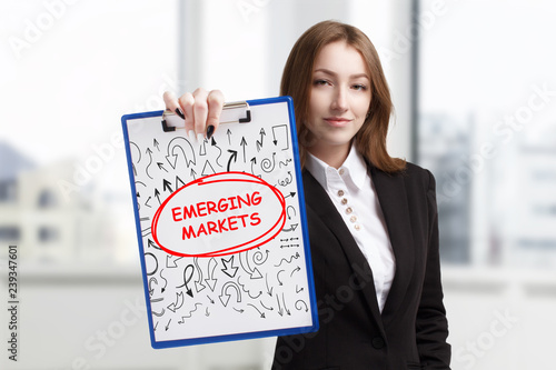 Free Download Business, technology, internet and networking concept. Young entrepreneur showing keyword: Emerging markets - GFXLoad