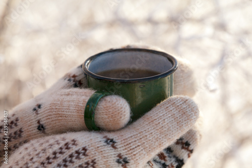 Wallpaper Mural Drinking tea in the winter outdoors. Women's hands in mittens ho Torontodigital.ca