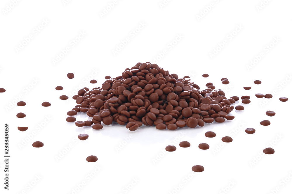 Chocolate Chips pile or small candies on White Background Chocolate Chips pile or small candies on White Background