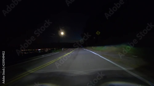 Night predawn driving on famous Mulholland Drive in the Santa Monica Mountains above Los Angeles, Burbank and Hollywood in Southern California. photo