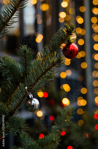 Wallpaper Mural Building decorated with a New Year Christmas tree with matte silver and red balls. Yellow bokeh at the background. Concept of winter holidays Torontodigital.ca